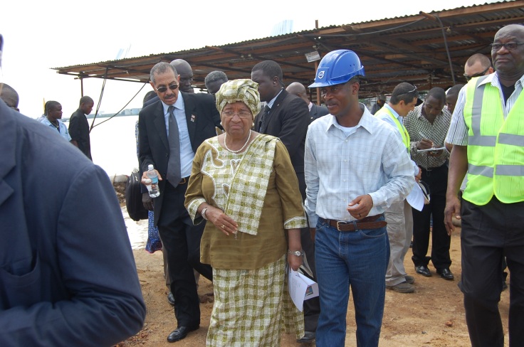 Liberian President Ellen Johnson Sirleaf and her Labour Minister Samuel Kofi Woods touring the construction site 